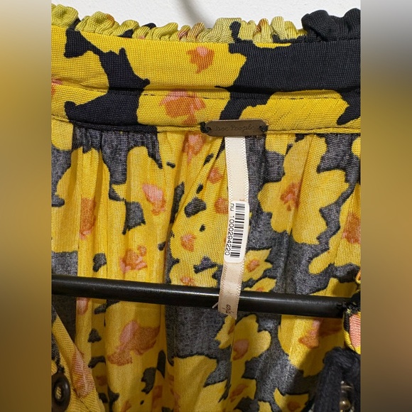 Free People Love Letter Floral Tunic Blouse in a black and yellow floral print. - Picture 4 of 11